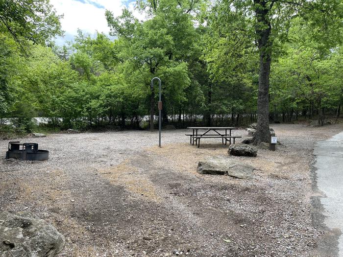 A photo of Site 28 of Loop Cold Springs at Cold Springs Campground (OK) Chickasaw NRA with Picnic Table, Fire Pit, Lantern Pole