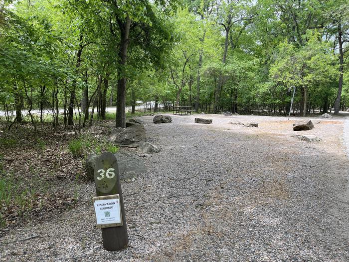 A photo of Site 36 at Cold Springs Campground (OK) Chickasaw NRA with Picnic Table, Fire Pit, Lantern Pole
