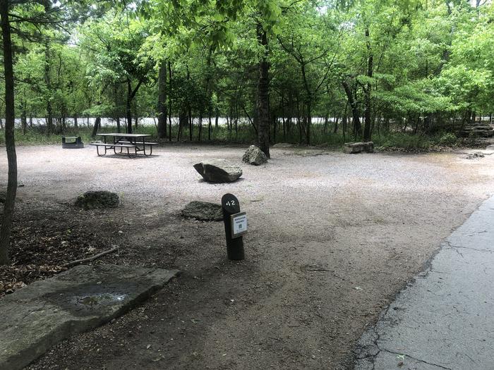 A photo of Site 42 of Loop Cold Springs at Cold Springs Campground (OK) Chickasaw NRA with Picnic Table, Fire Pit, Lantern Pole