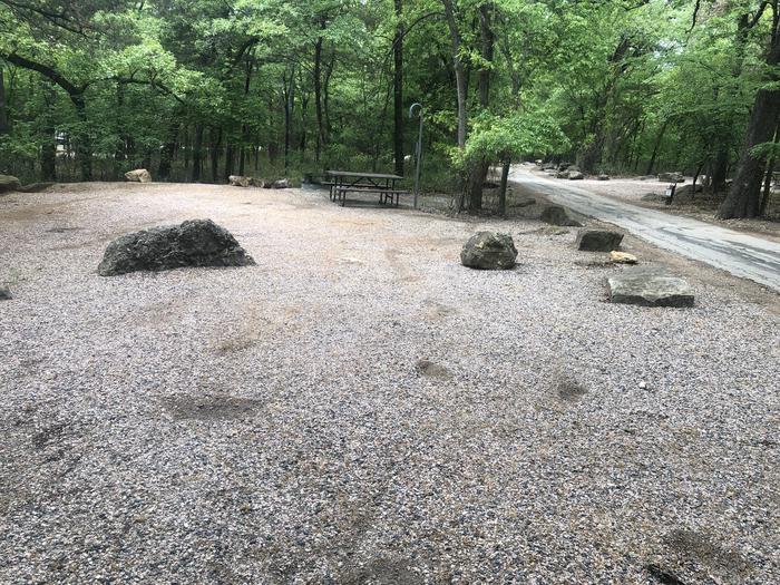 A photo of Site 57 of Loop Cold Springs at Cold Springs Campground (OK) Chickasaw NRA with Picnic Table, Fire Pit, Lantern Pole