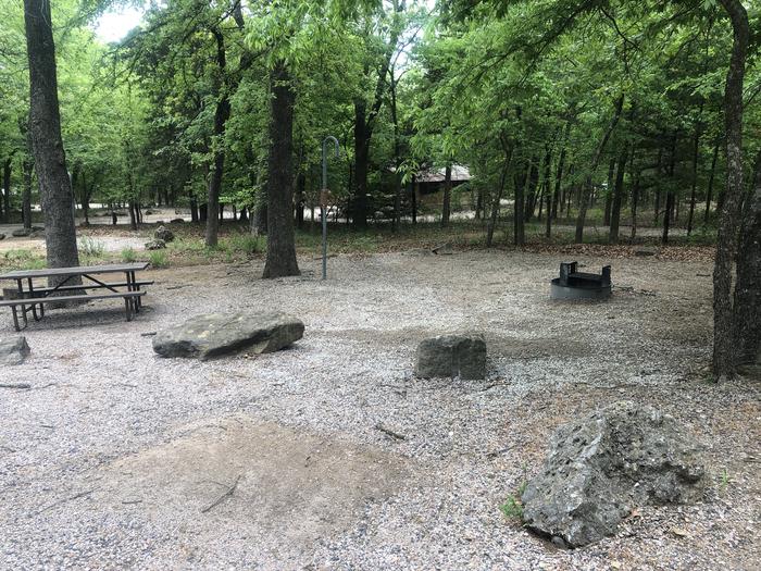 A photo of Site 55 of Loop Cold Springs at Cold Springs Campground (OK) Chickasaw NRA with Picnic Table, Fire Pit, Lantern Pole