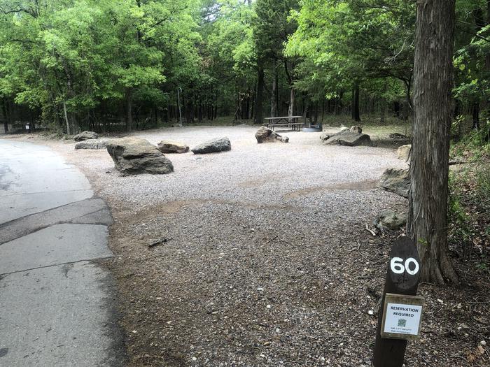 A photo of Site 60 of Loop Cold Springs at Cold Springs Campground (OK) Chickasaw NRA with Picnic Table, Fire Pit, Lantern Pole