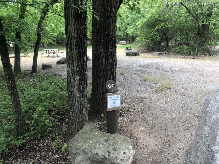 A photo of Site 50 of Loop Cold Springs at Cold Springs Campground (OK) Chickasaw NRA with Picnic Table, Fire Pit, Lantern Pole