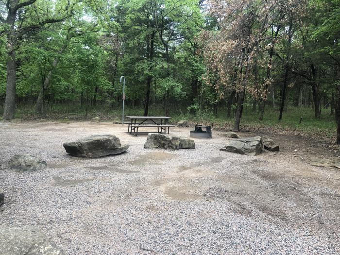 A photo of Site 58 of Loop Cold Springs at Cold Springs Campground (OK) Chickasaw NRA with Picnic Table, Fire Pit, Lantern Pole