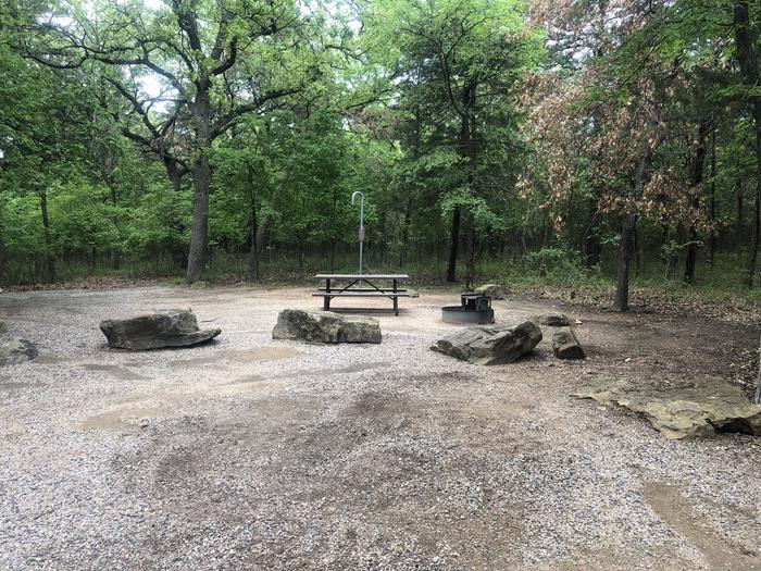 A photo of Site 58 of Loop Cold Springs at Cold Springs Campground (OK) Chickasaw NRA with Picnic Table, Fire Pit, Lantern Pole