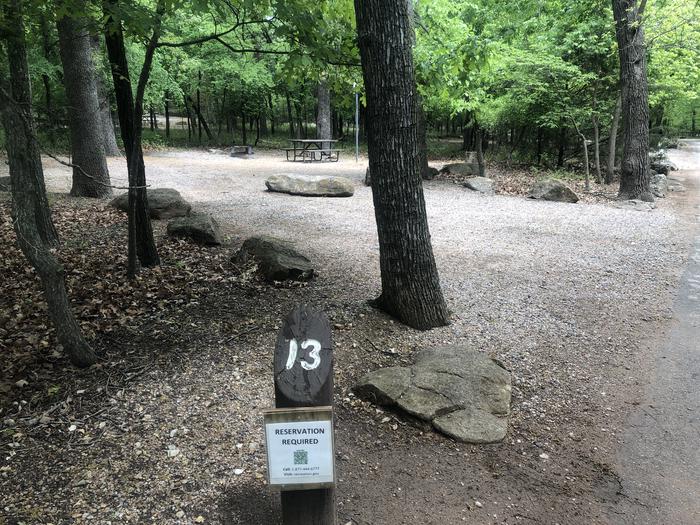 A photo of Site 13 of Loop Cold Springs at Cold Springs Campground (OK) Chickasaw NRA with Picnic Table, Fire Pit, Lantern Pole