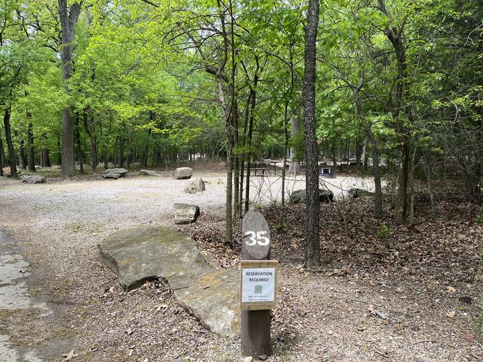 A photo of Site 35 at Cold Springs Campground (OK) Chickasaw NRA with Picnic Table, Fire Pit, Lantern Pole