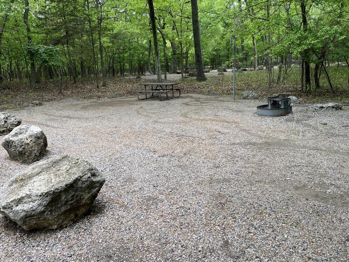 A photo of Site 27 at Cold Springs Campground (OK) Chickasaw NRA with Picnic Table, Fire Pit, Lantern Pole
