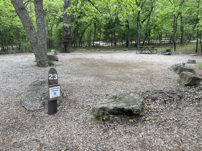 A photo of Site 23 at Cold Springs Campground (OK) Chickasaw NRA with Picnic Table, Fire Pit, Lantern Pole
