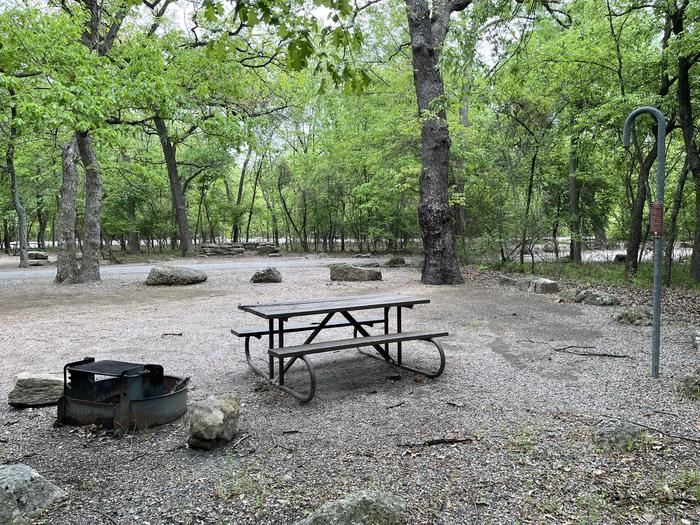 A photo of Site 23 of Loop Cold Springs at Cold Springs Campground (OK) Chickasaw NRA with Picnic Table, Fire Pit, Lantern Pole