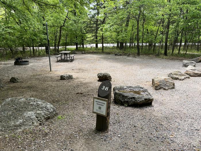 A photo of Site 38 at Cold Springs Campground (OK) Chickasaw NRA with Picnic Table, Fire Pit, Lantern Pole