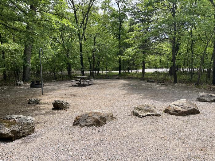 A photo of Site 38 at Cold Springs Campground (OK) Chickasaw NRA with Picnic Table, Fire Pit, Lantern Pole