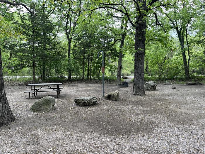 A photo of Site 25 of Loop Cold Springs at Cold Springs Campground (OK) Chickasaw NRA with Picnic Table, Fire Pit, Lantern Pole