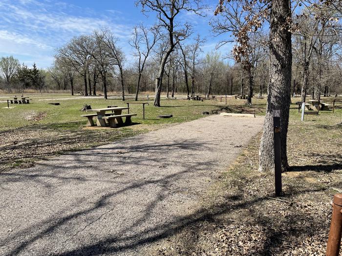 A photo of Site F25 of Loop F at LAKESIDE (OK) with Picnic Table, Electricity Hookup, Fire Pit, Shade, Water Hookup