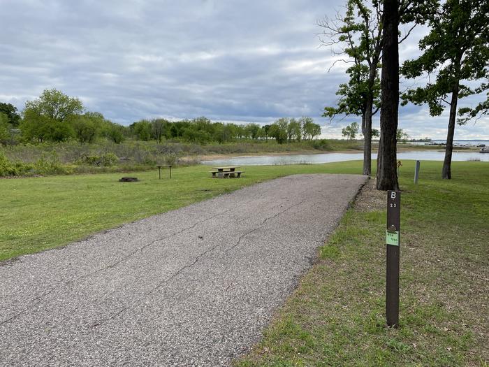 A photo of Site B23 of Loop B at LAKESIDE (OK) with Picnic Table, Electricity Hookup, Fire Pit, Waterfront, Water Hookup