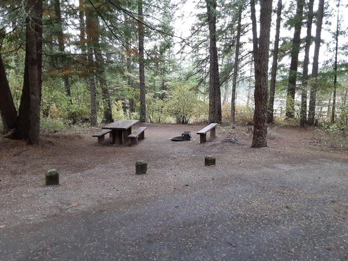 A photo of Site 013 of Loop MOKINS BAY CAMPGROUND at MOKINS BAY CAMPGROUND with Picnic Table, Fire Pit, Shade
