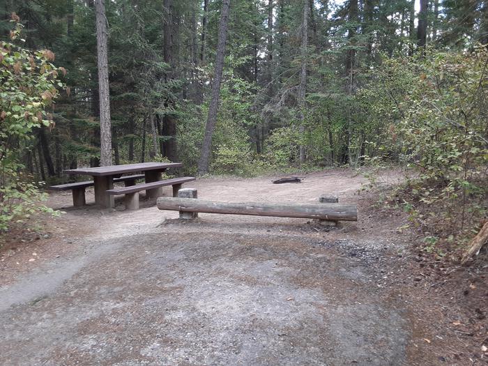A photo of Site 014 of Loop MOKINS BAY CAMPGROUND at MOKINS BAY CAMPGROUND with Picnic Table, Fire Pit, Shade