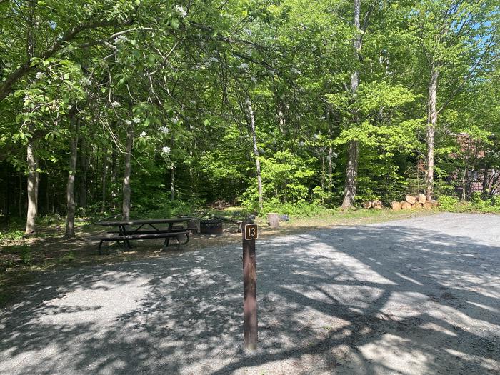 A photo of Site 13 of Loop  at Grout Pond Campground with Picnic Table, Fire Pit, Shade