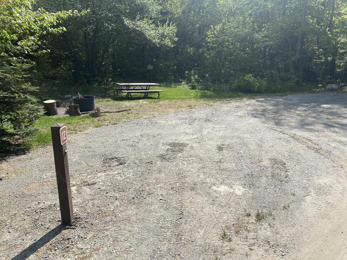 A photo of Site 12 of Loop  at Grout Pond Campground with Picnic Table, Fire Pit, Shade