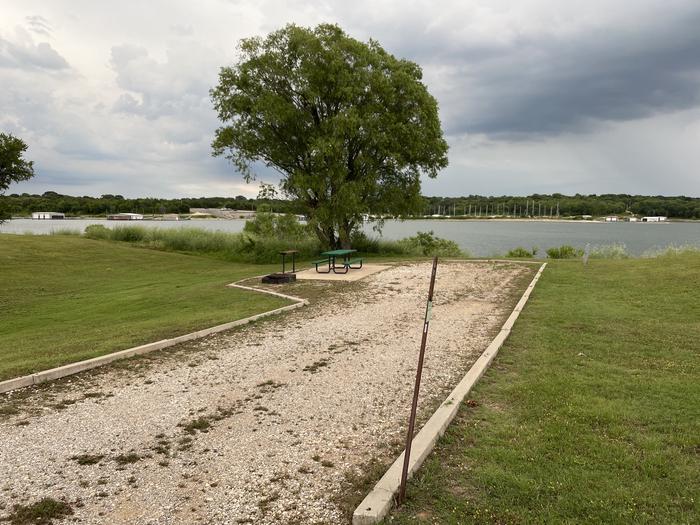 A photo of Site A30 of Loop A at CANEY CREEK with Picnic Table, Electricity Hookup, Fire Pit, Waterfront, Water Hookup