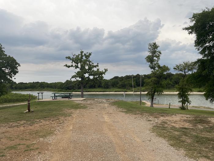 A photo of Site A35 of Loop A at CANEY CREEK with Picnic Table, Electricity Hookup, Fire Pit, Waterfront, Water Hookup