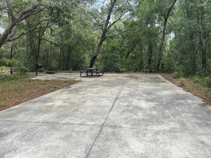 A photo of Site 15 of Loop Big Bass Campground at Big Bass Campground (FL) with Picnic Table, Fire Pit, Shade, Lantern Pole