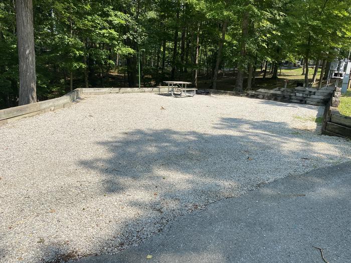 A photo of Site 06 of Loop CPOI at CUMBERLAND POINT CAMPGROUND with Boat Ramp, Picnic Table, Electricity Hookup, Fire Pit, Shade, Lantern Pole, Water Hookup