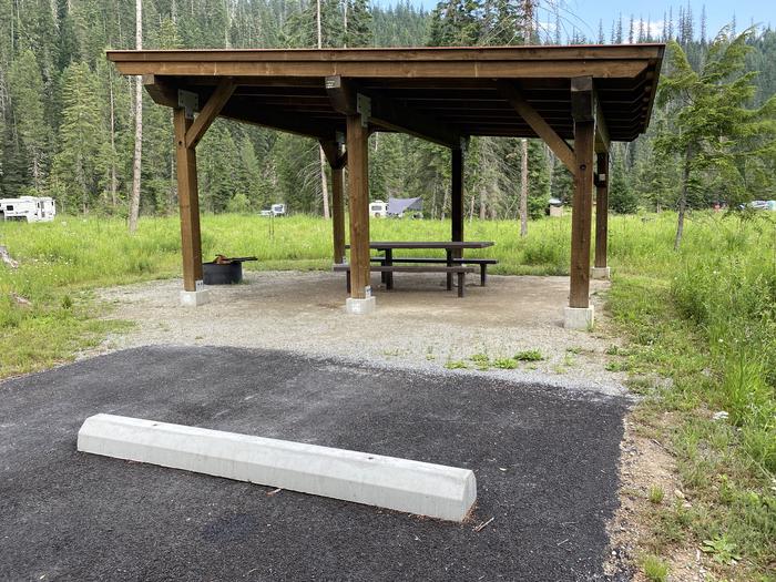 A photo of Site C055 of Loop C at KIT PRICE with Picnic Table, Fire Pit, Shade