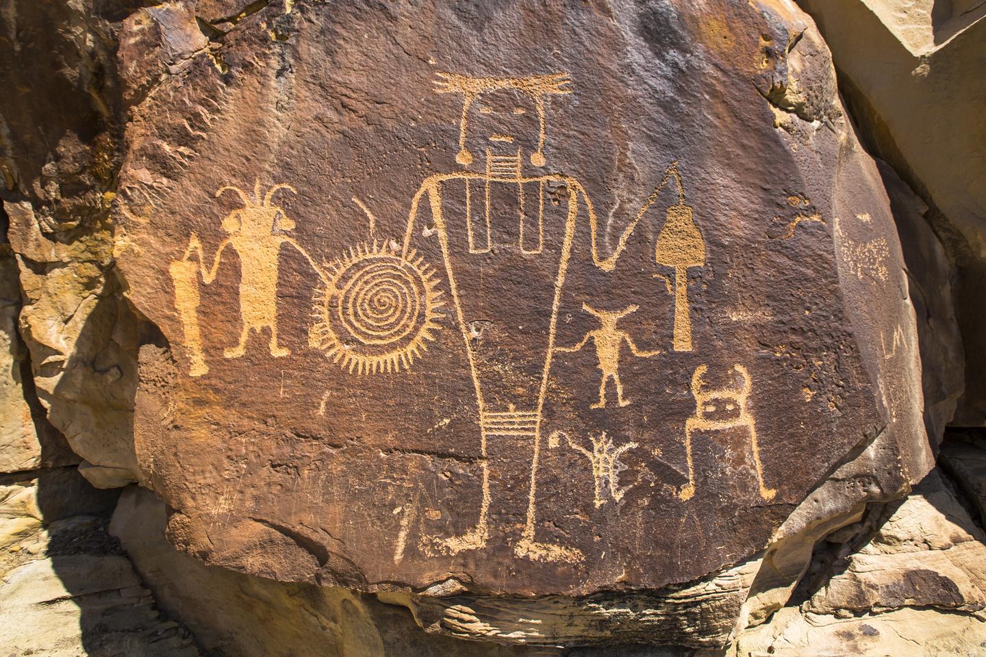 McKee Springs PetroglyphsThe ancestral indigenous peoples left petroglyphs on many of the rock cliffs within Dinosaur National Monument including those at McKee Springs