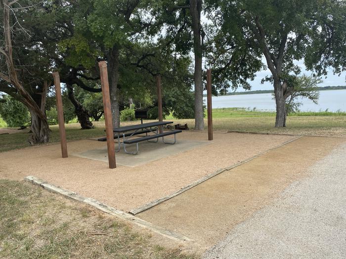 picnic table, grill, and fire ring with great view of Waco Lake
