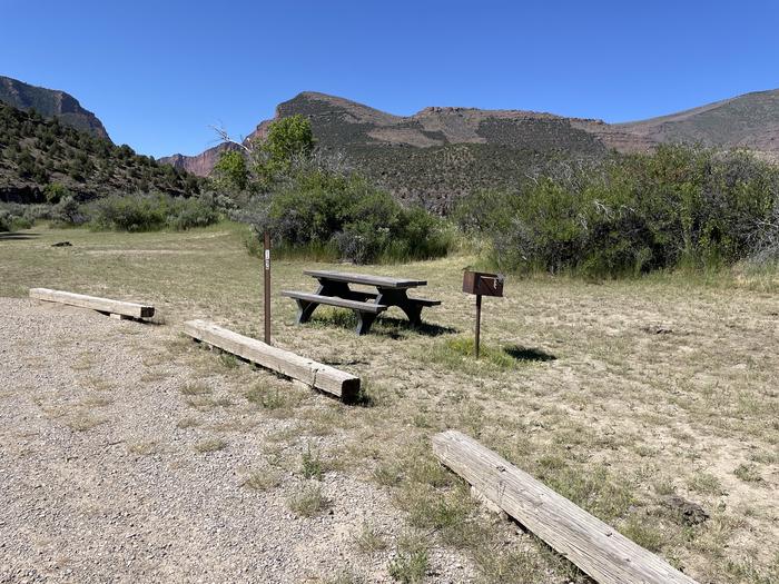 A photo of Site 12 of Loop  at Gates of Lodore Campground with Picnic Table