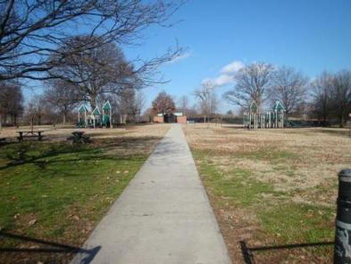 The photo shows a sidewalk passing through the Hains Point Picnic AreaHains Point Picnic Area