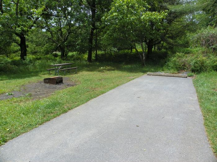 D150Site D150 has a driveway, picnic table, fire ring, and tent pad.