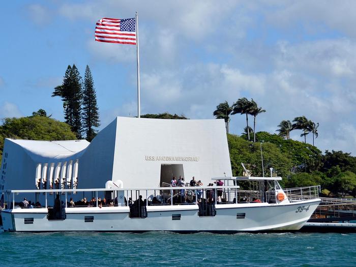 A boat docks at the USS Arizona MemorialVisitors from all over the world pay their respects at the USS Arizona Memorial.