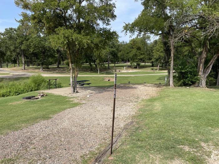 A photo of Site A26 of Loop A at CANEY CREEK with Picnic Table, Electricity Hookup, Fire Pit, Shade, Waterfront, Water Hookup