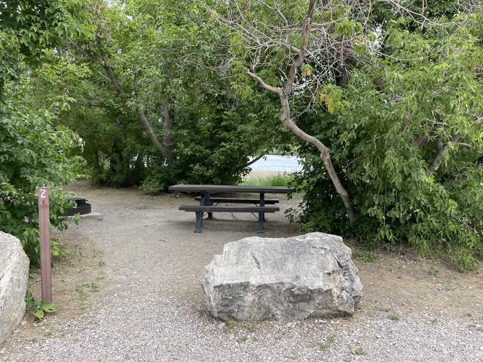 A photo of Site 2 of Loop  at Rainbow Park Campground with Picnic Table, Fire Pit, Shade, Waterfront