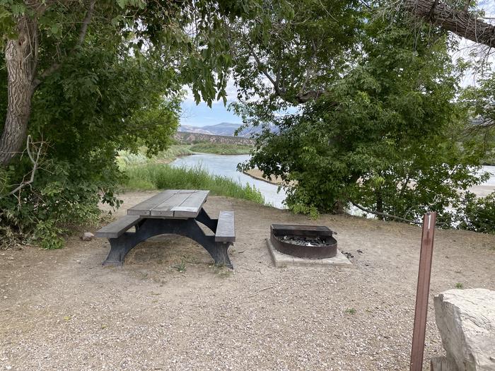 A photo of Site 1 of Loop  at Rainbow Park Campground with Picnic Table, Fire Pit, Shade, Waterfront