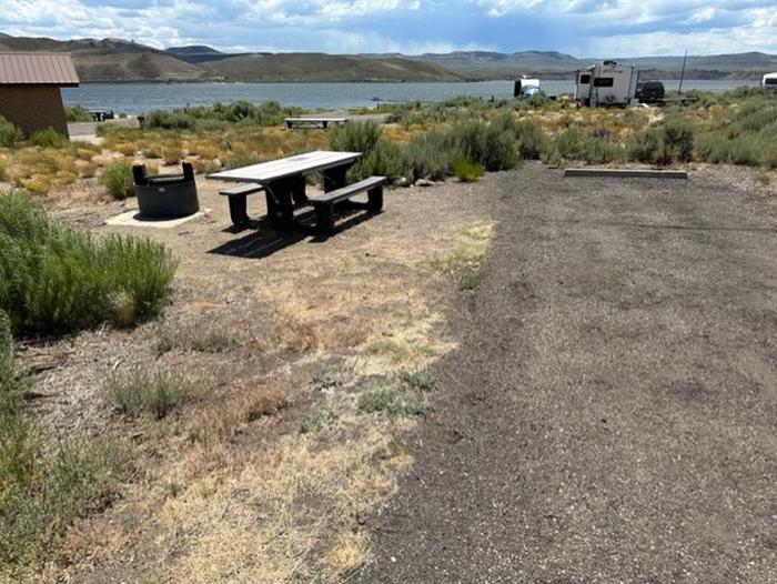 Campsite 15: picnic table, and firepit. Set in sagebrush.Loop A Campsite 15: picnic table, and firepit.