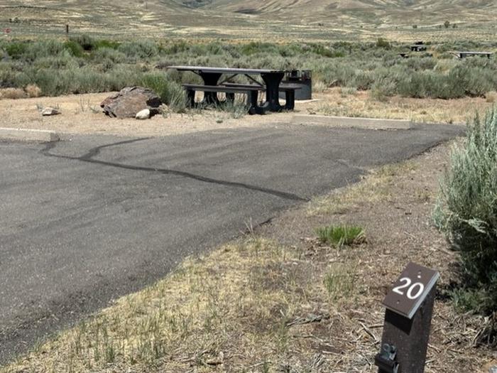 Campsite 20: wide driveway, picnic table, and firepit. Set in sagebrush with view of mesas and vault toilet.Loop A Campsite 17: wide driveway, picnic table, and firepit.