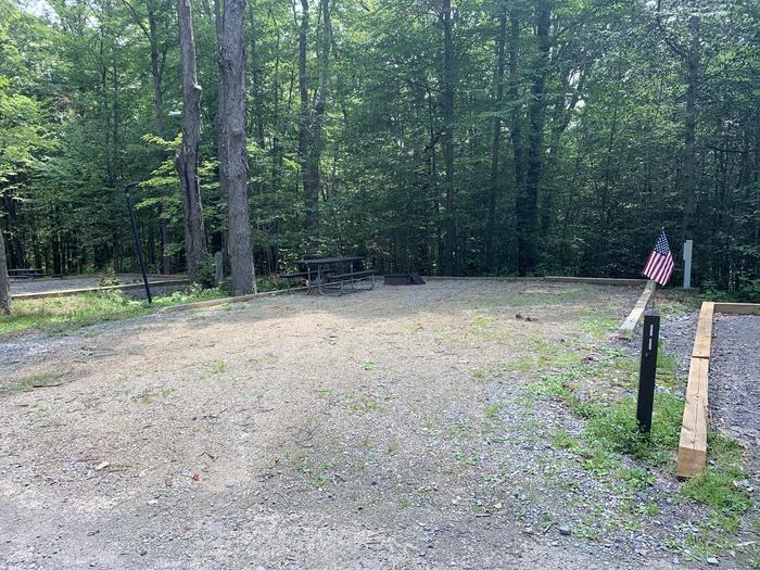 A photo of Site 11 of Loop East Branch at East Branch Campground with Picnic Table, Electricity Hookup, Fire Pit, Shade, Lantern Pole
