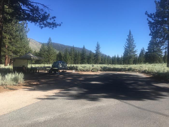 A photo of Site 025 of Loop FAM at CRAGS CAMPGROUND with Picnic Table, Fire Pit, Shade, Food Storage, Tent Pad