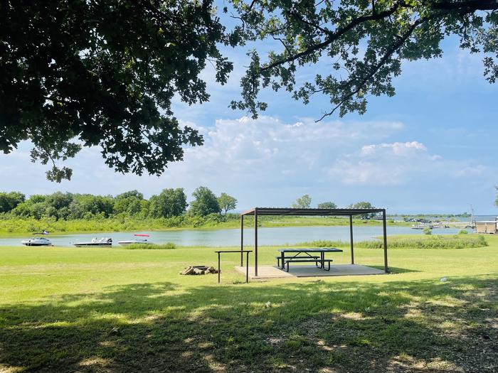 A photo of facility LAKESIDE (OK) with Picnic Table, Shade, Waterfront, Water Hookup