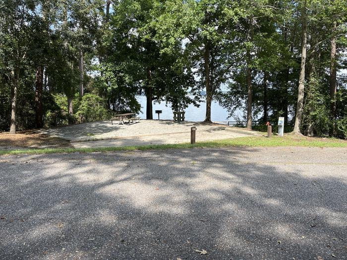 A photo of Site 123 of Loop RCHA at WHITE OAK (CREEK) CAMPGROUND with Picnic Table, Electricity Hookup, Sewer Hookup, Fire Pit, Shade, Tent Pad, Full Hookup, Waterfront, Lantern Pole, Water Hookup