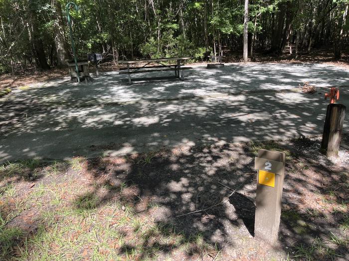 A photo of Site 02 of Loop UTRA at BLUFF CREEK with Picnic Table, Electricity Hookup, Fire Pit, Shade, Lantern Pole, Water Hookup