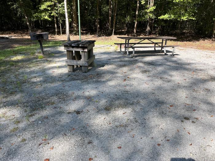 A photo of Site 04 of Loop UTRA at BLUFF CREEK with Picnic Table, Electricity Hookup, Fire Pit, Shade, Lantern Pole, Water Hookup