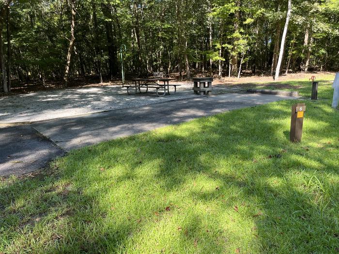 A photo of Site 05 of Loop UTRA at BLUFF CREEK with Picnic Table, Electricity Hookup, Fire Pit, Shade, Lantern Pole, Water Hookup