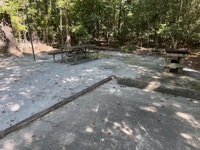 A photo of Site 11 of Loop MRUN at BLUFF CREEK with Picnic Table, Electricity Hookup, Fire Pit, Shade, Lantern Pole, Water Hookup