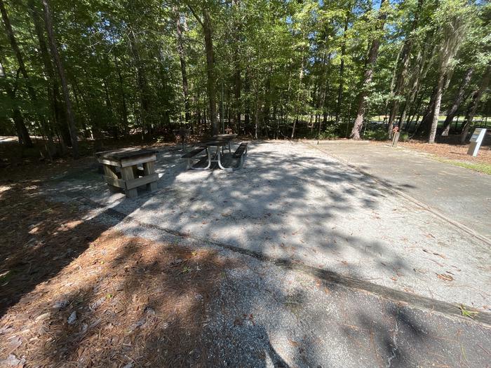 A photo of Site 21 of Loop RFOR at BLUFF CREEK with Picnic Table, Electricity Hookup, Fire Pit, Shade, Lantern Pole, Water Hookup