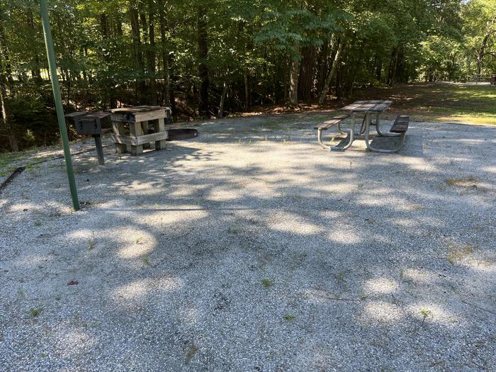 A photo of Site 19 of Loop MRUN at BLUFF CREEK with Picnic Table, Electricity Hookup, Fire Pit, Shade, Lantern Pole, Water Hookup