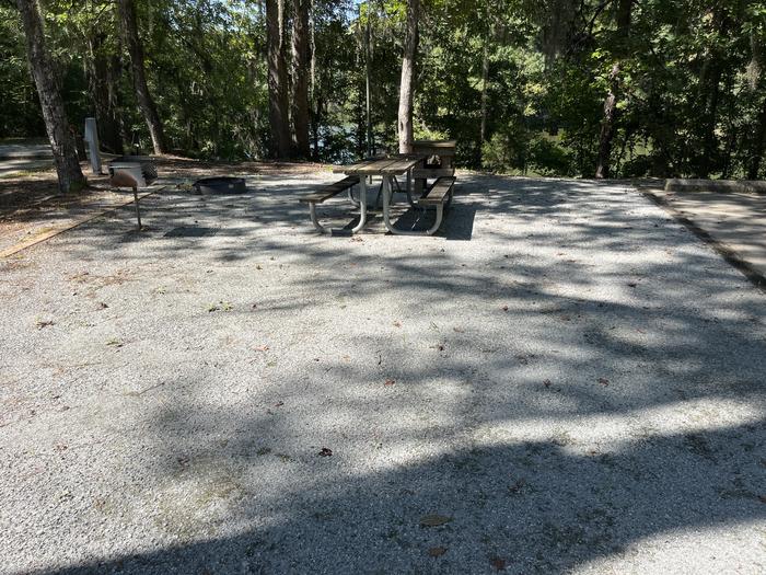 A photo of Site 17 of Loop MRUN at BLUFF CREEK with Picnic Table, Electricity Hookup, Fire Pit, Shade, Lantern Pole, Water Hookup